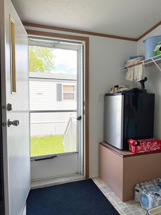 20429 326th Ave Unit 15, Isle, MN 56342 - doorway featuring ornamental molding and a textured ceiling