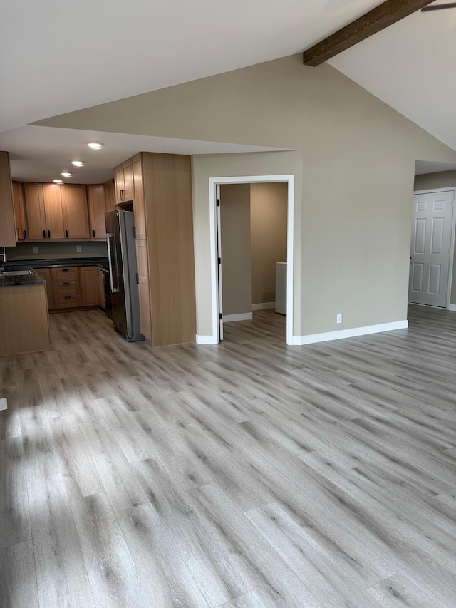 14646 Tradewinds Rd, Lake Eunice Twp, MN 56511 - kitchen featuring freestanding refrigerator, open floor plan, light wood finished floors, baseboards, and recessed lighting