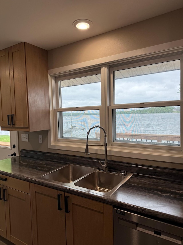 14646 Tradewinds Rd, Lake Eunice Twp, MN 56511 - kitchen featuring dishwasher, dark countertops, a sink, healthy amount of natural light, and recessed lighting