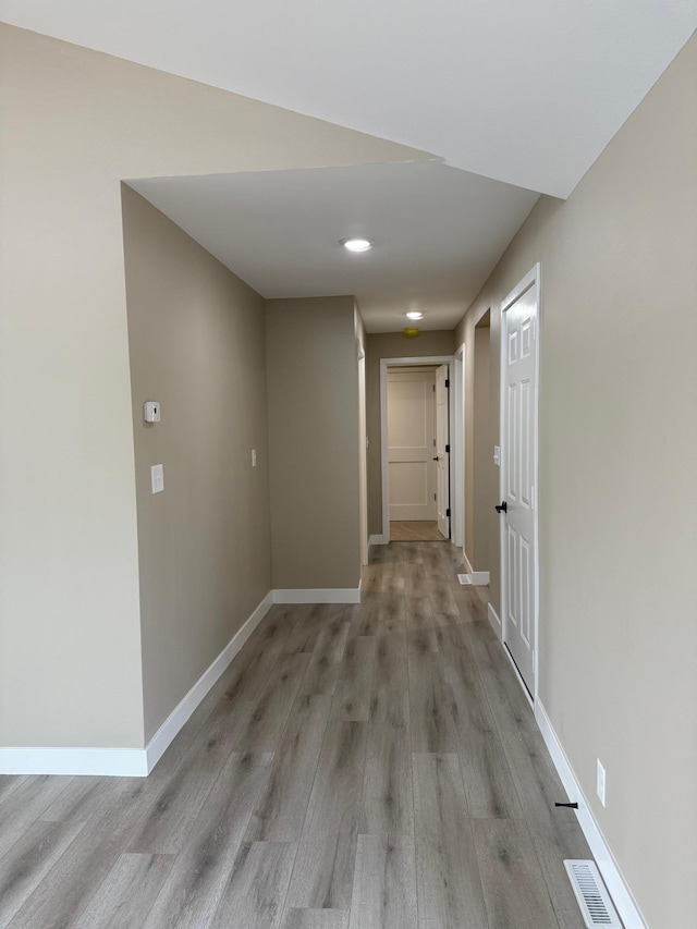 14646 Tradewinds Rd, Lake Eunice Twp, MN 56511 - hallway with light wood-style flooring and baseboards