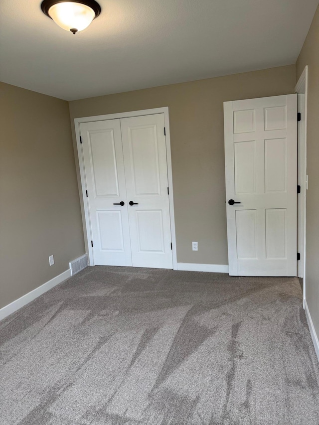 14646 Tradewinds Rd, Lake Eunice Twp, MN 56511 - unfurnished bedroom with a closet, carpet, and baseboards