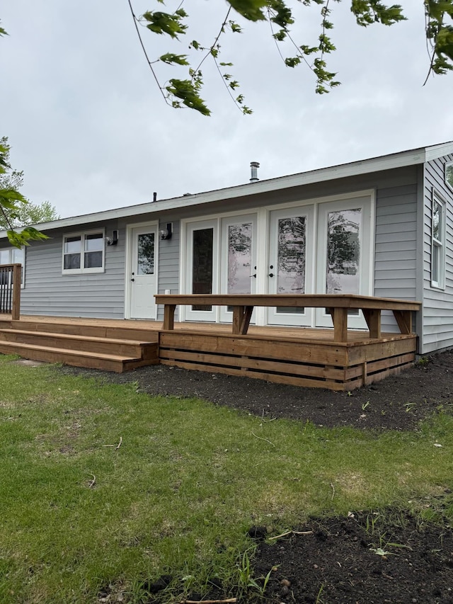 14646 Tradewinds Rd, Lake Eunice Twp, MN 56511 - rear view of house featuring a wooden deck and a yard
