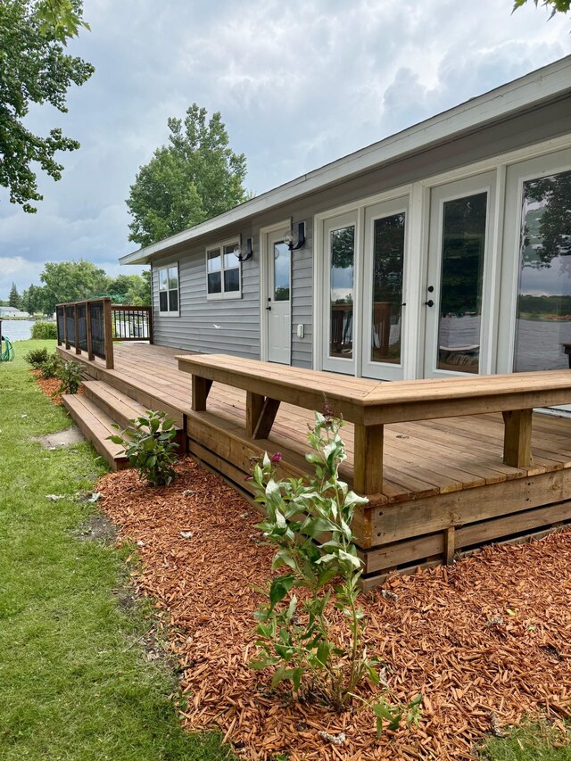 14646 Tradewinds Rd, Lake Eunice Twp, MN 56511 - wooden deck featuring a yard and a water view