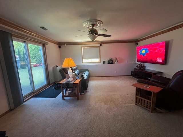 1803 214th Ave NE, East Bethel, MN 55011 - living room with carpet, crown molding, and ceiling fan