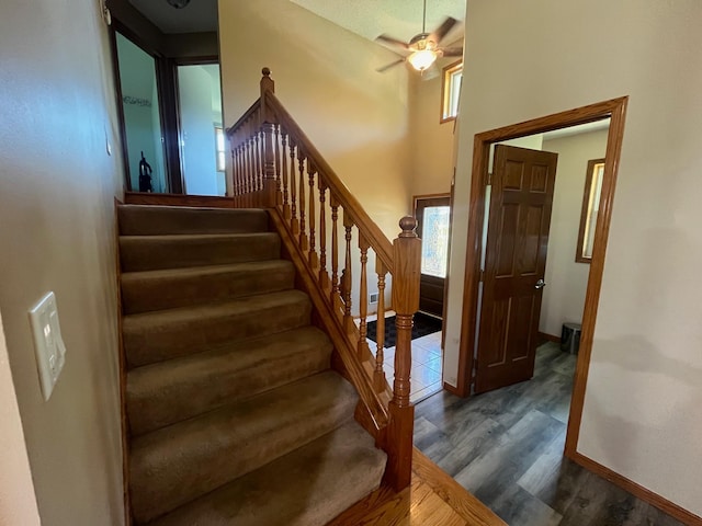 1803 214th Ave NE, East Bethel, MN 55011 - stairs with wood finished floors, ceiling fan, healthy amount of natural light, and a high ceiling
