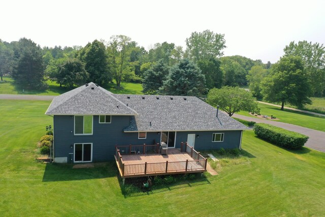 1803 214th Ave NE, East Bethel, MN 55011 - rear view of house featuring a wooden deck and a yard