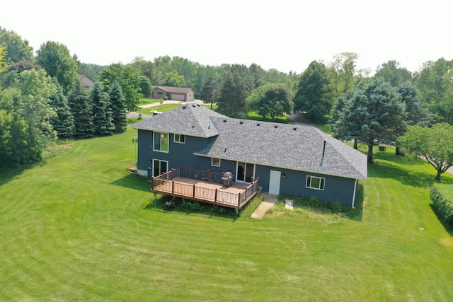 1803 214th Ave NE, East Bethel, MN 55011 - rear view of house with a deck, a yard, and roof with shingles