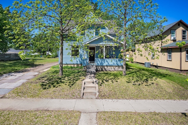 431 19 1/2 Ave N, Saint Cloud, MN 56303 - view of front of home featuring central AC unit and a front lawn