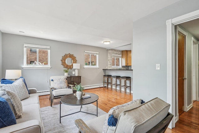 4515 Grand Ave S Unit 1, Minneapolis, MN 55419 - living area with a baseboard heating unit, wood finished floors, and baseboards
