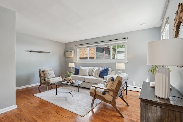 4515 Grand Ave S Unit 1, Minneapolis, MN 55419 - living area featuring a wall mounted AC, wood finished floors, a baseboard radiator, and baseboards