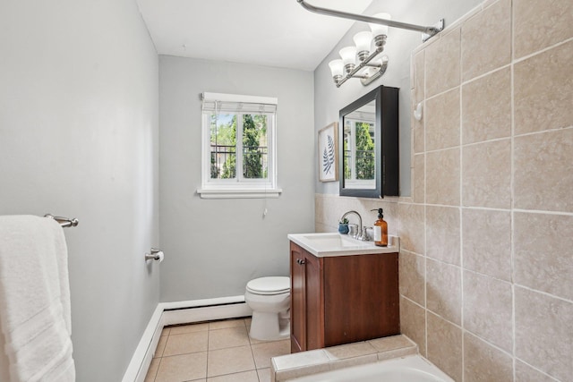 4515 Grand Ave S Unit 1, Minneapolis, MN 55419 - bathroom with tile patterned floors, toilet, baseboards, a baseboard heating unit, and vanity