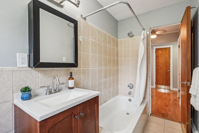4515 Grand Ave S Unit 1, Minneapolis, MN 55419 - full bathroom with shower / tub combo, tile patterned flooring, tile walls, and vanity