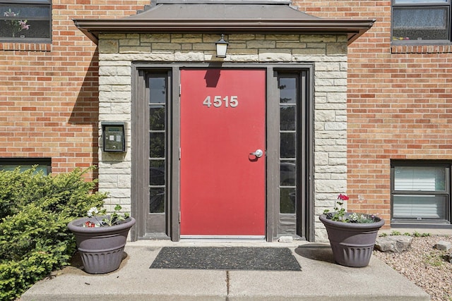4515 Grand Ave S Unit 1, Minneapolis, MN 55419 - doorway to property featuring brick siding and stone siding