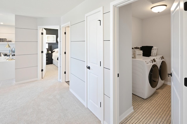 1165 Woods Creek Dr S, Delano, MN 55328 - laundry room featuring washing machine and clothes dryer and baseboards