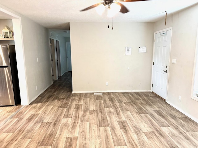 424 2nd St N, Greenbush, MN 56726 - empty room featuring a ceiling fan, light wood-type flooring, and baseboards