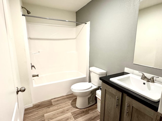 424 2nd St N, Greenbush, MN 56726 - bathroom featuring wood finished floors, toilet, shower / bath combination, and vanity
