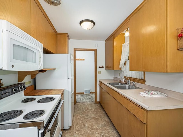 3401 Yukon Ave S, Saint Louis Park, MN 55426 - kitchen featuring white appliances, a sink, light countertops, and stone finish flooring