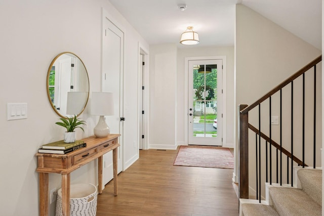 5350 41st Ave S, Minneapolis, MN 55417 - entryway with wood finished floors, stairs, and baseboards