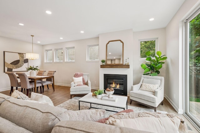 5350 41st Ave S, Minneapolis, MN 55417 - living room with recessed lighting, a glass covered fireplace, wood finished floors, and baseboards