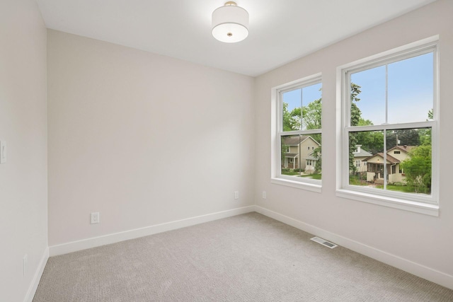 5350 41st Ave S, Minneapolis, MN 55417 - spare room with baseboards and light carpet
