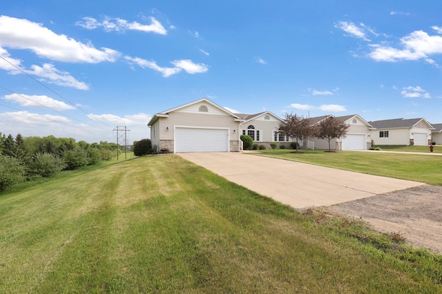 2245 198th St W, Faribault, MN 55021 - view of front of house with concrete driveway, a front lawn, stone siding, and an attached garage