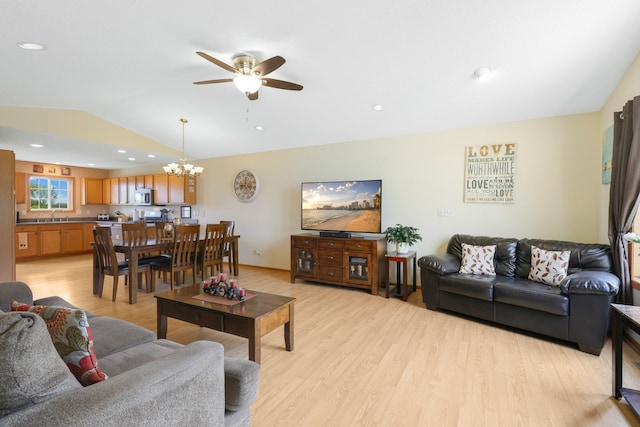 2245 198th St W, Faribault, MN 55021 - living area featuring vaulted ceiling, light wood-style floors, a ceiling fan, a chandelier, and recessed lighting