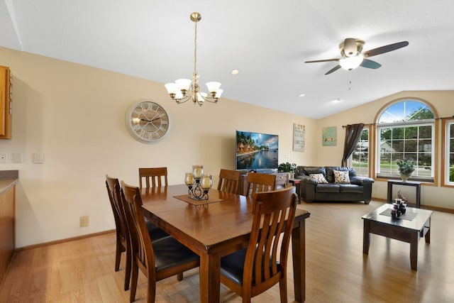 2245 198th St W, Faribault, MN 55021 - dining room featuring light wood-style flooring, a ceiling fan, baseboards, lofted ceiling, and a chandelier