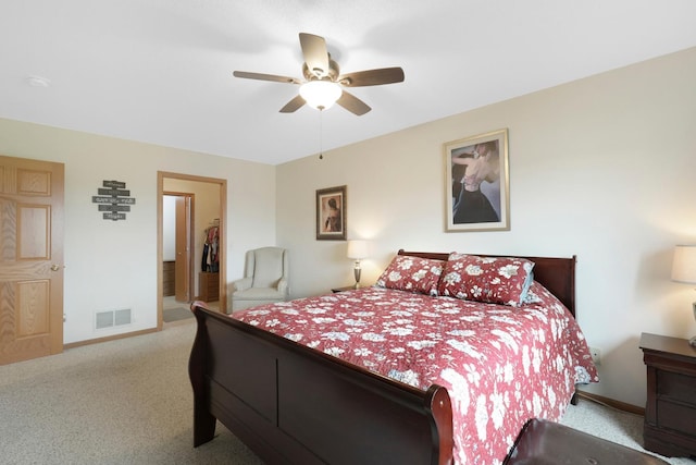 2245 198th St W, Faribault, MN 55021 - bedroom with carpet floors, baseboards, a spacious closet, and a ceiling fan
