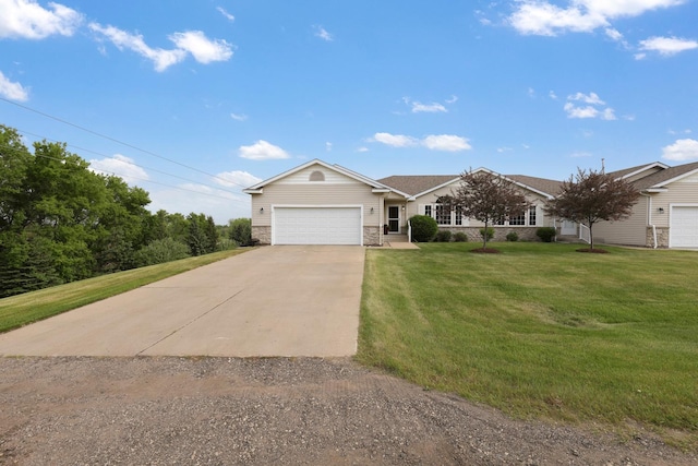 2245 198th St W, Faribault, MN 55021 - ranch-style house featuring an attached garage, concrete driveway, a front lawn, and stone siding