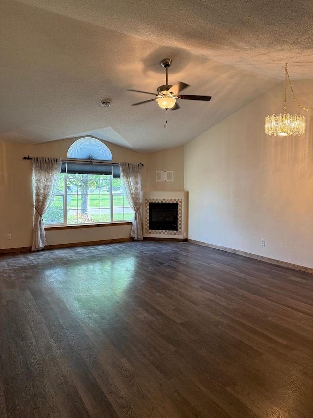 446 30th St N, Moorhead, MN 56560 - unfurnished living room featuring lofted ceiling, baseboards, wood finished floors, a ceiling fan, and a textured ceiling