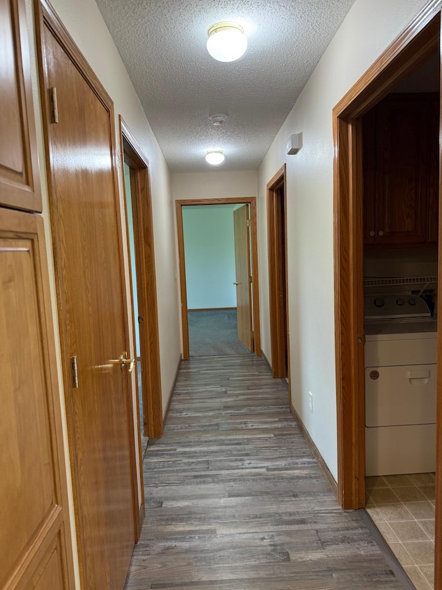 446 30th St N, Moorhead, MN 56560 - hallway featuring a textured ceiling and wood finished floors
