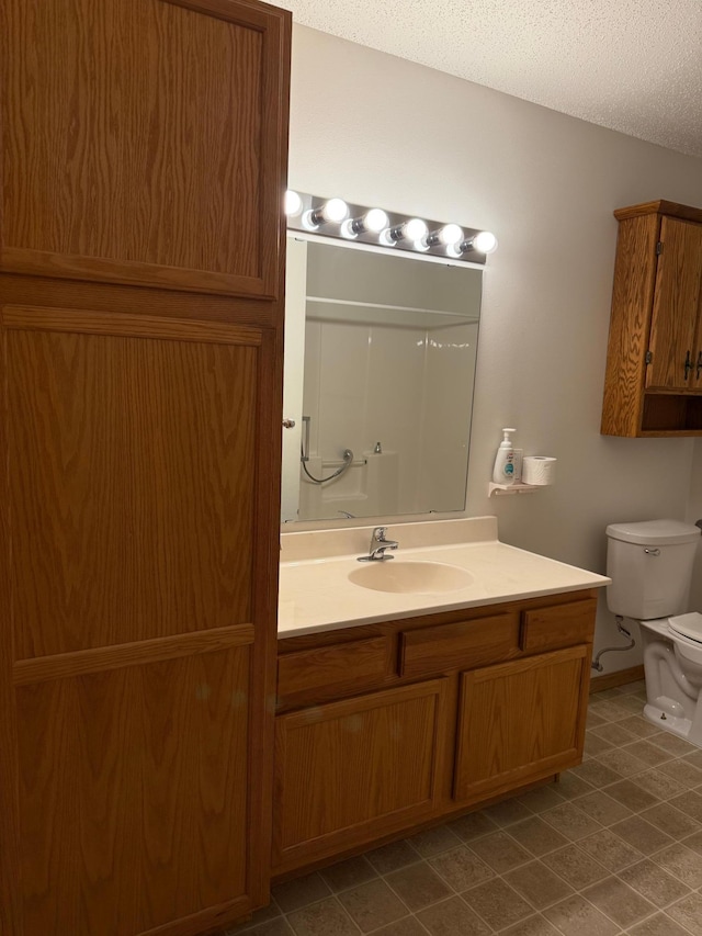 446 30th St N, Moorhead, MN 56560 - full bath with toilet, vanity, a textured ceiling, and a shower
