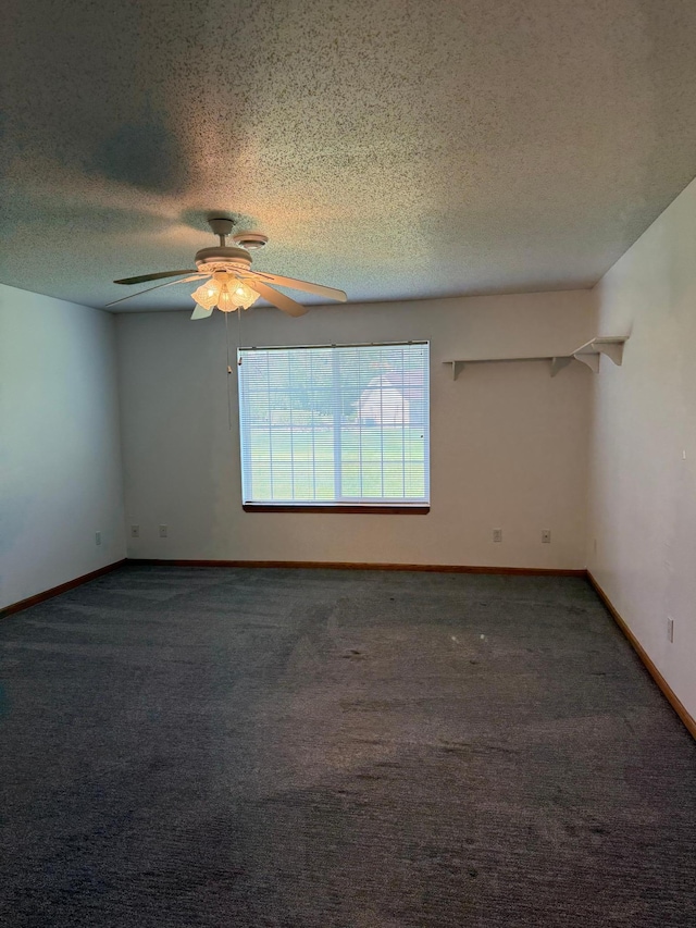 446 30th St N, Moorhead, MN 56560 - unfurnished room with a ceiling fan, a textured ceiling, carpet flooring, and baseboards