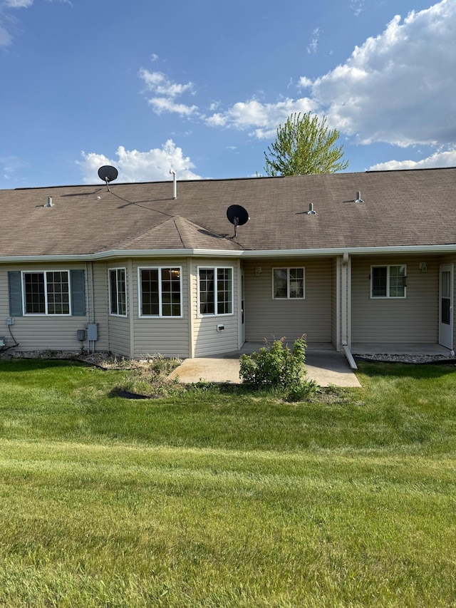446 30th St N, Moorhead, MN 56560 - back of property featuring a patio, a yard, and roof with shingles