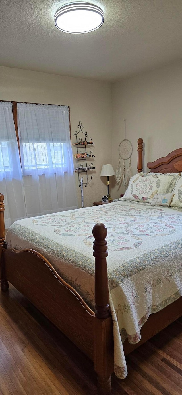 114 6th Ave, Albert Lea, MN 56007 - bedroom with wood finished floors and a textured ceiling