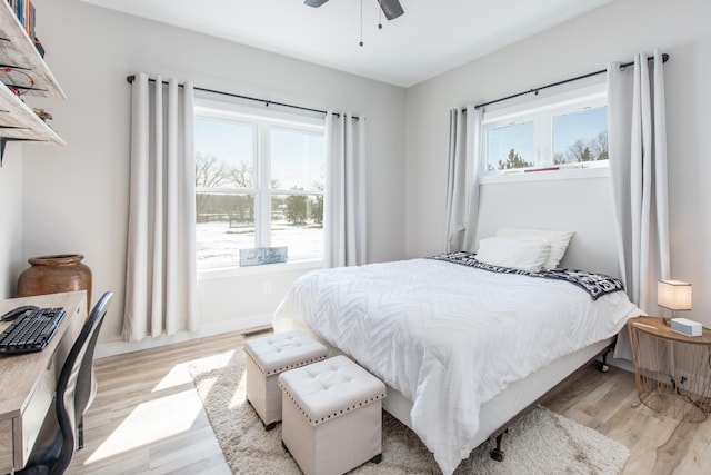 bedroom with light wood finished floors and ceiling fan
