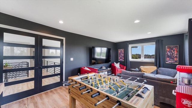 playroom featuring french doors, wood finished floors, and recessed lighting
