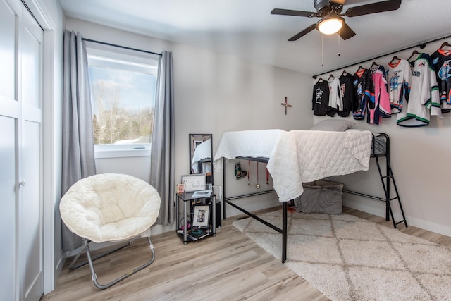 bedroom featuring wood finished floors and ceiling fan