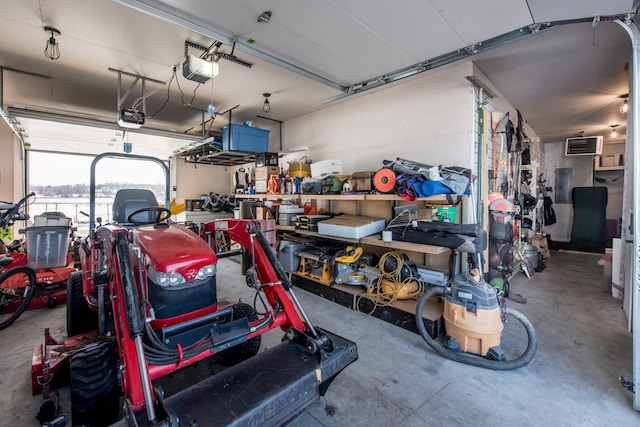 garage with a garage door opener and electric panel