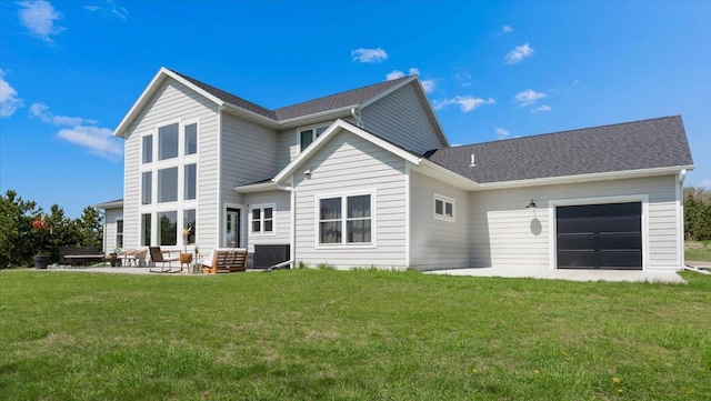 rear view of house with a patio and a yard