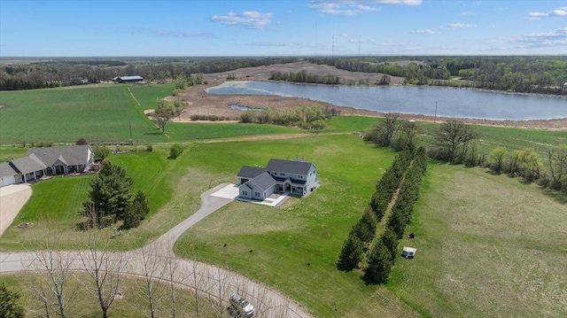 aerial view of sparsely populated area with a large body of water