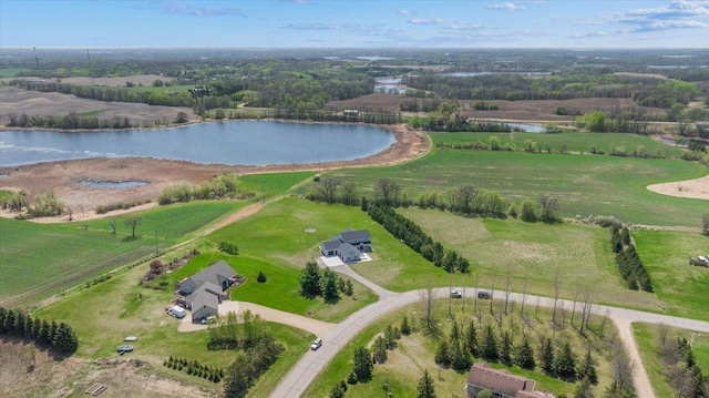aerial view of property's location with a large body of water and rural landscape