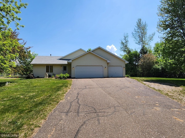 31785 Foxhill Ave, Lent Twp, MN 55079 - ranch-style home with asphalt driveway, a garage, and a front yard