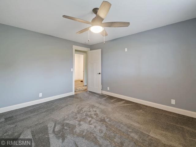 1706 57th Ave, Hammond, WI 54015 - carpeted spare room featuring baseboards and a ceiling fan