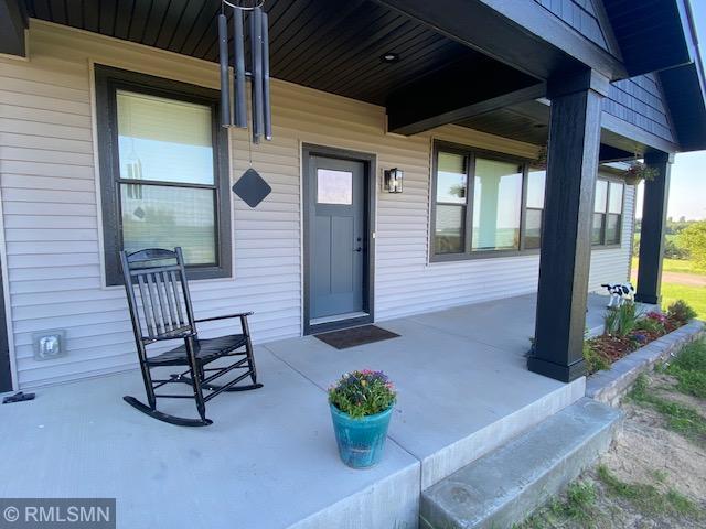 1706 57th Ave, Hammond, WI 54015 - doorway to property with a porch