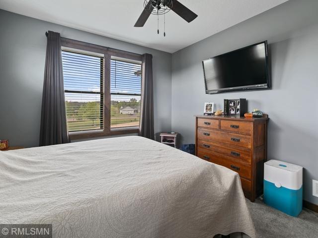 1706 57th Ave, Hammond, WI 54015 - carpeted bedroom with ceiling fan
