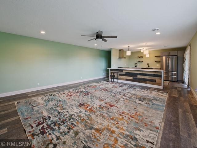 1706 57th Ave, Hammond, WI 54015 - living area featuring dark wood-type flooring, a ceiling fan, and recessed lighting