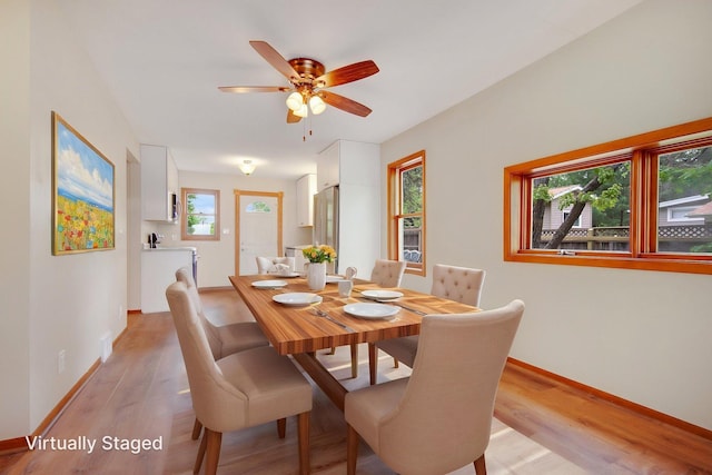 22718 Martin Lake Dr NE, Linwood Twp, MN 55092 - dining space featuring light wood finished floors and ceiling fan