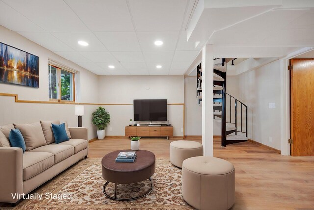 22718 Martin Lake Dr NE, Linwood Twp, MN 55092 - living area featuring wood finished floors, stairway, and recessed lighting