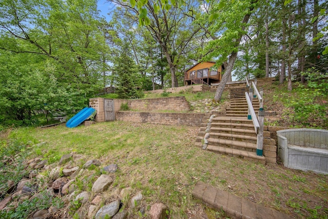 22718 Martin Lake Dr NE, Linwood Twp, MN 55092 - view of yard featuring stairway and a wooden deck